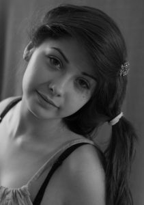 a black and white photo of a young woman