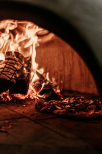 photo of pizza in furnace