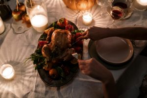 person slicing the turkey