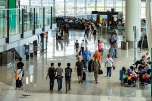 travelers at the airport terminal