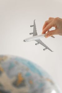 close up shot of a person holding an airplane toy
