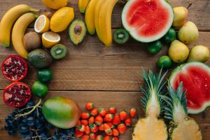 sliced fruits on wooden table